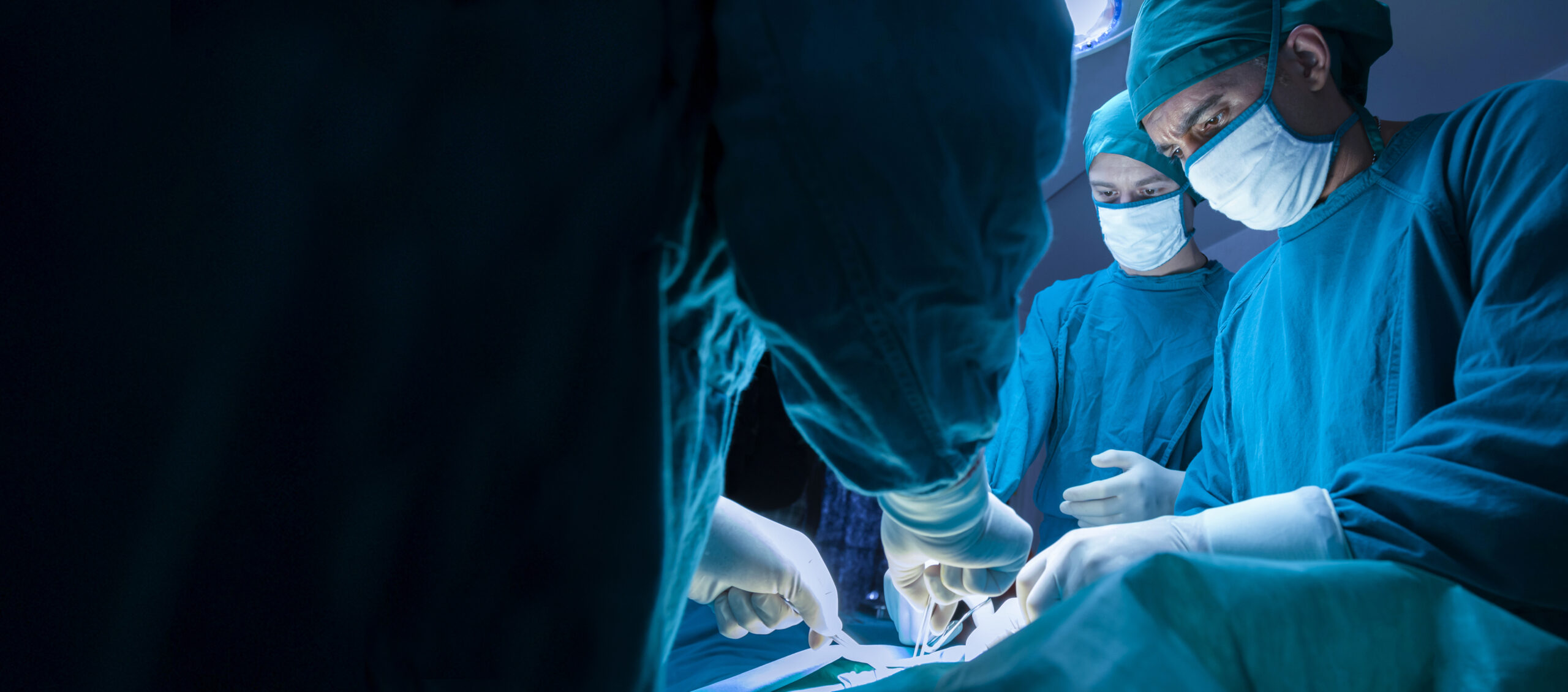 concentrated professional surgical doctor team operating surgery a patient in the operating room at the hospital. healthcare and medical concept.”n